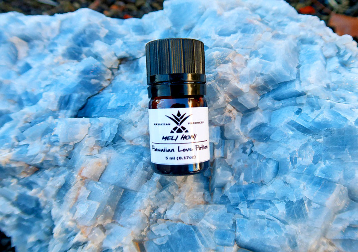 A bottle of Meli Honi on a light blue rock