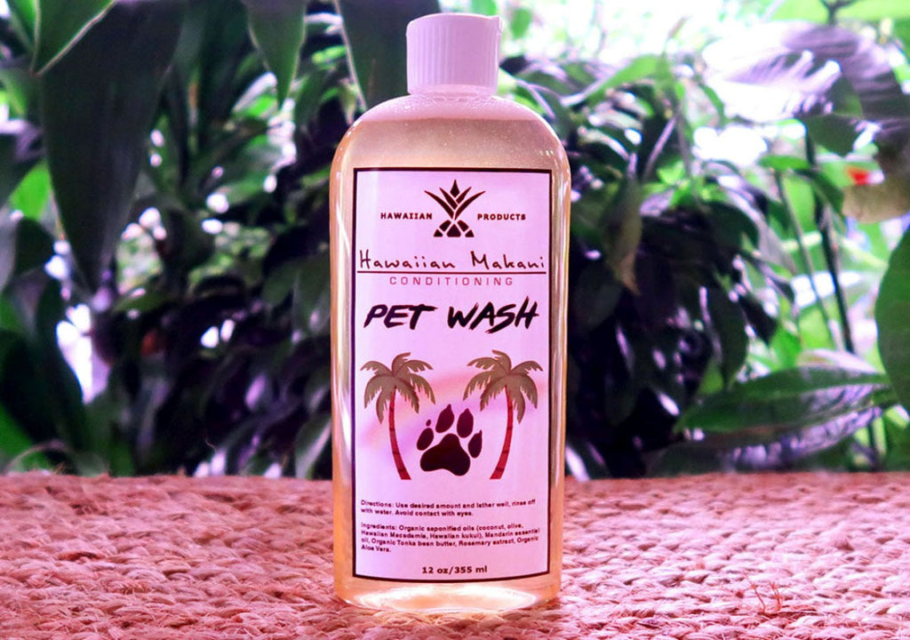 A bottle of Makani pet wash against a plant background